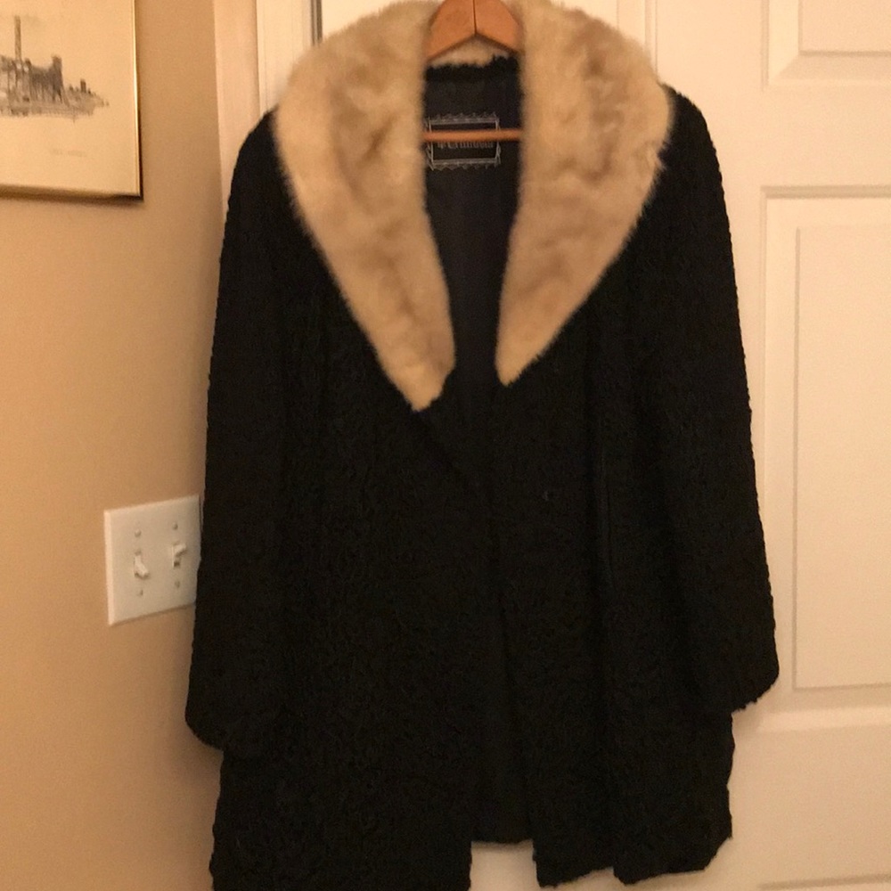 Lamb’s wool fur coat with mink collar.